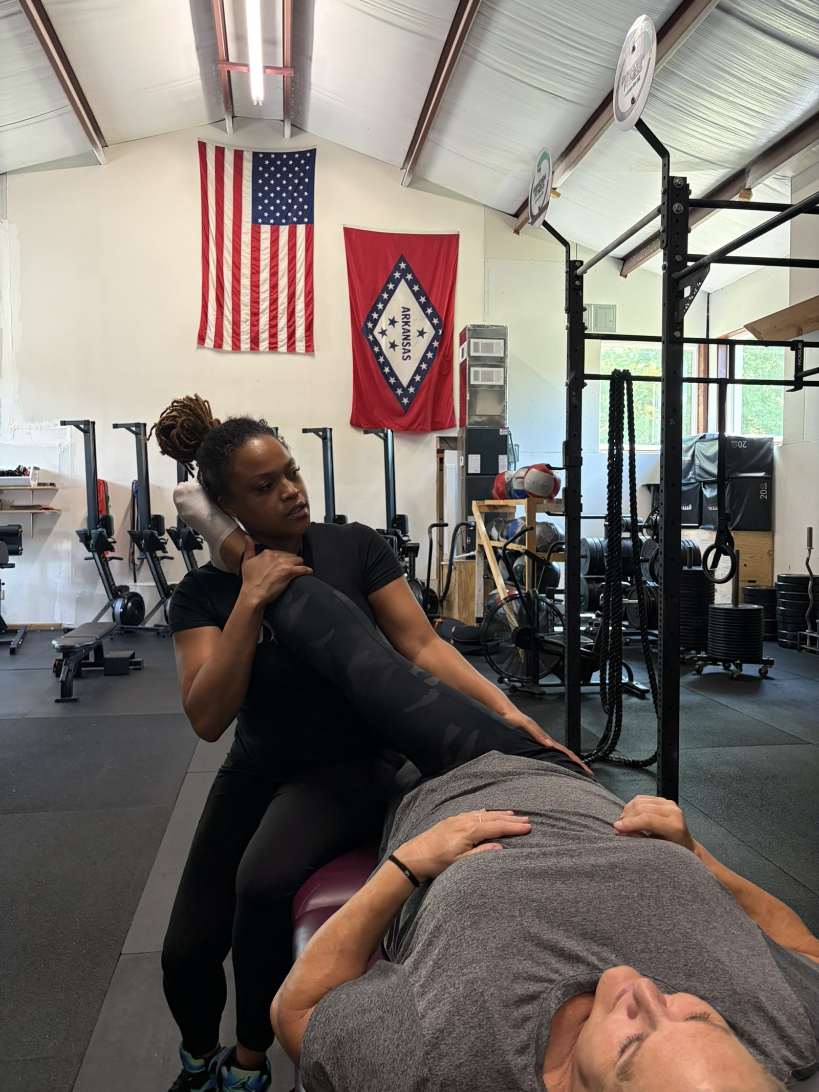 The therapist working through a close supported leg stretch